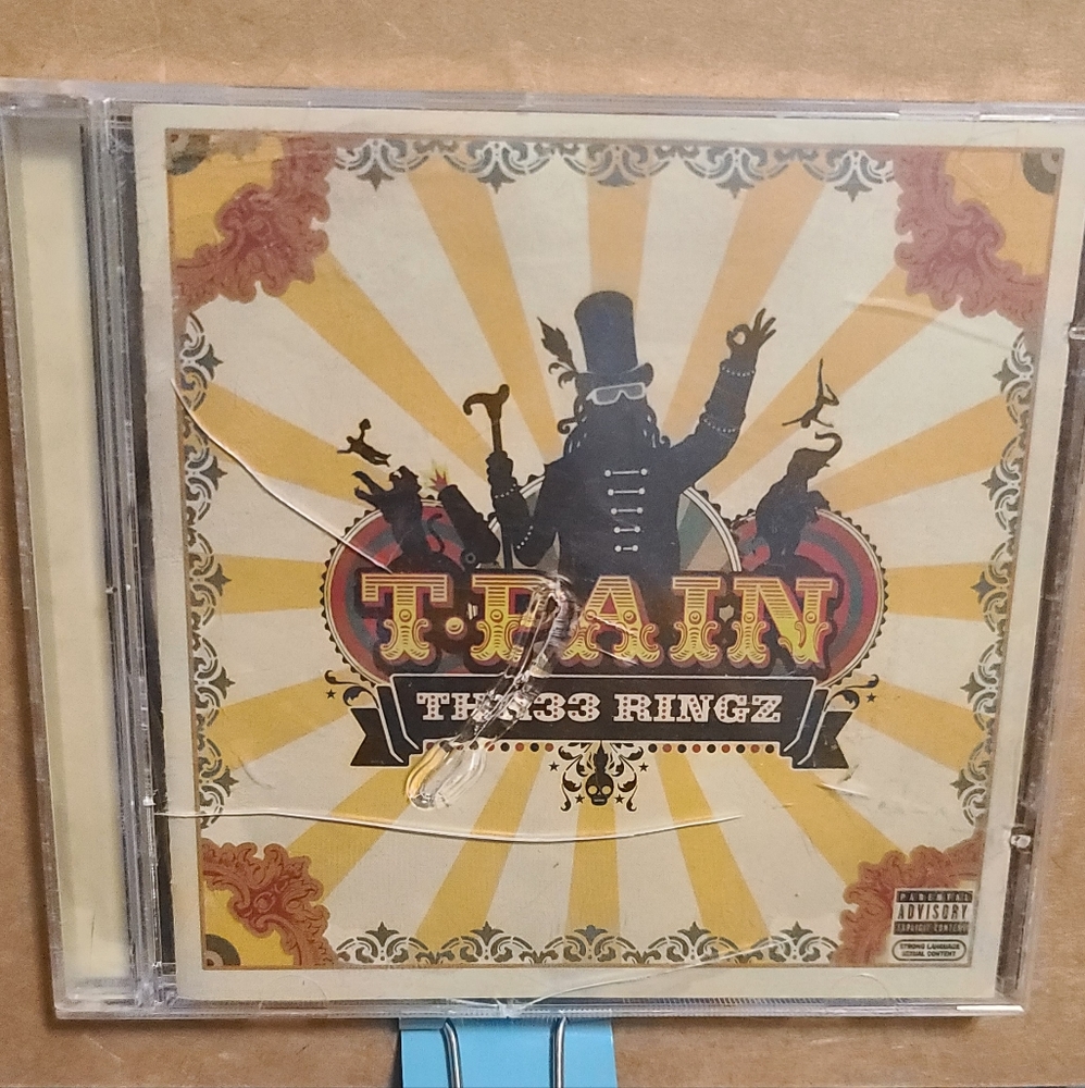 T Pain Thr33 Ringz cracked cover but cd fine i have not played this cd. As is - Picture 1 of 4